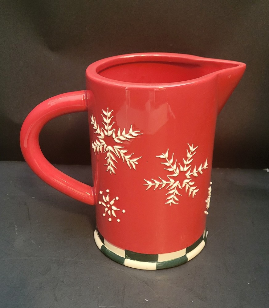 Red Ceramic Pitcher with Snowflake and Green and White checked base.
