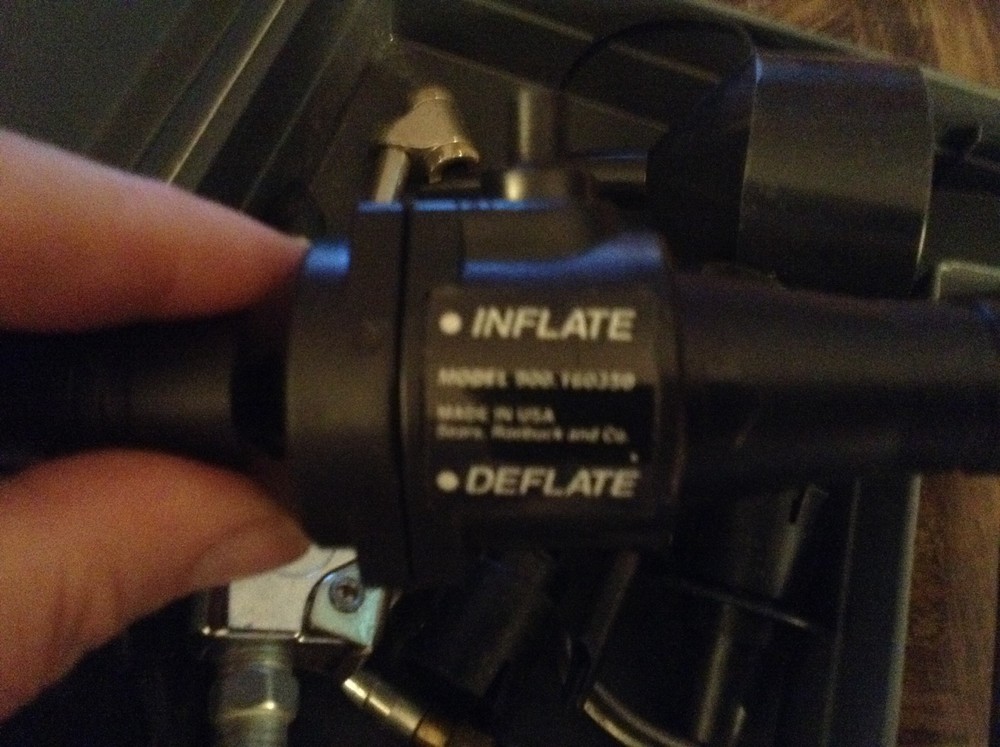 Plastic case full of air attachments etc.