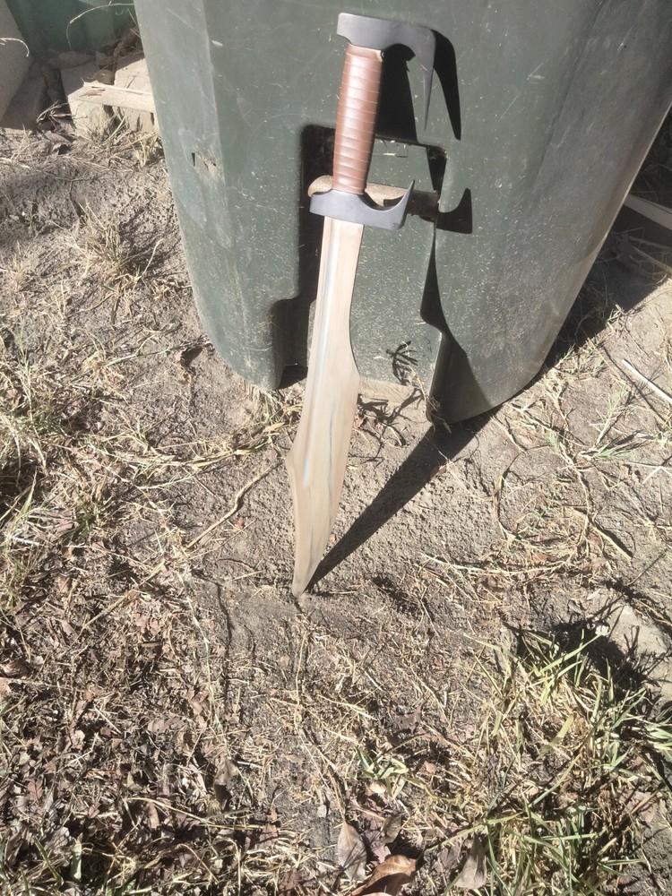 Unsharpened sword with carrying sheath and adjustable shoulder strap