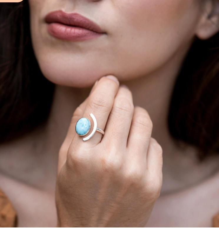 Adjustable Larimar ring with oval stone and silver designed in curved shape