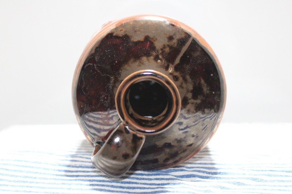 Brown Jug with Handle and a Chicken Design