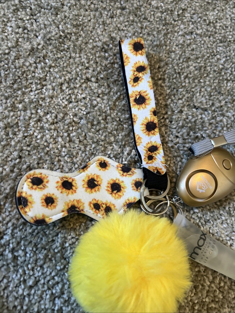 This is a sunflower-patterned self-defense keychain set