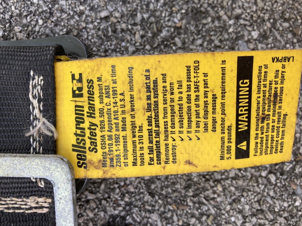 safety harness with strap attached