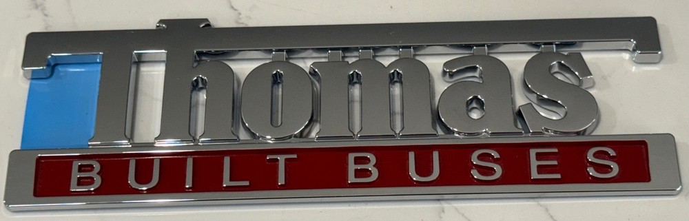 9" THOMAS BUILT BUSES EMBLEM WITH ADHESIVE BACK-OEM NOS NEW