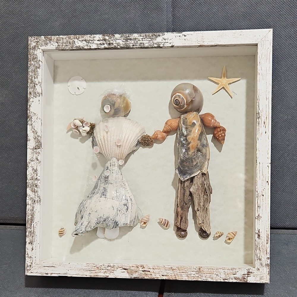 Unique seashell wedding couple art piece.