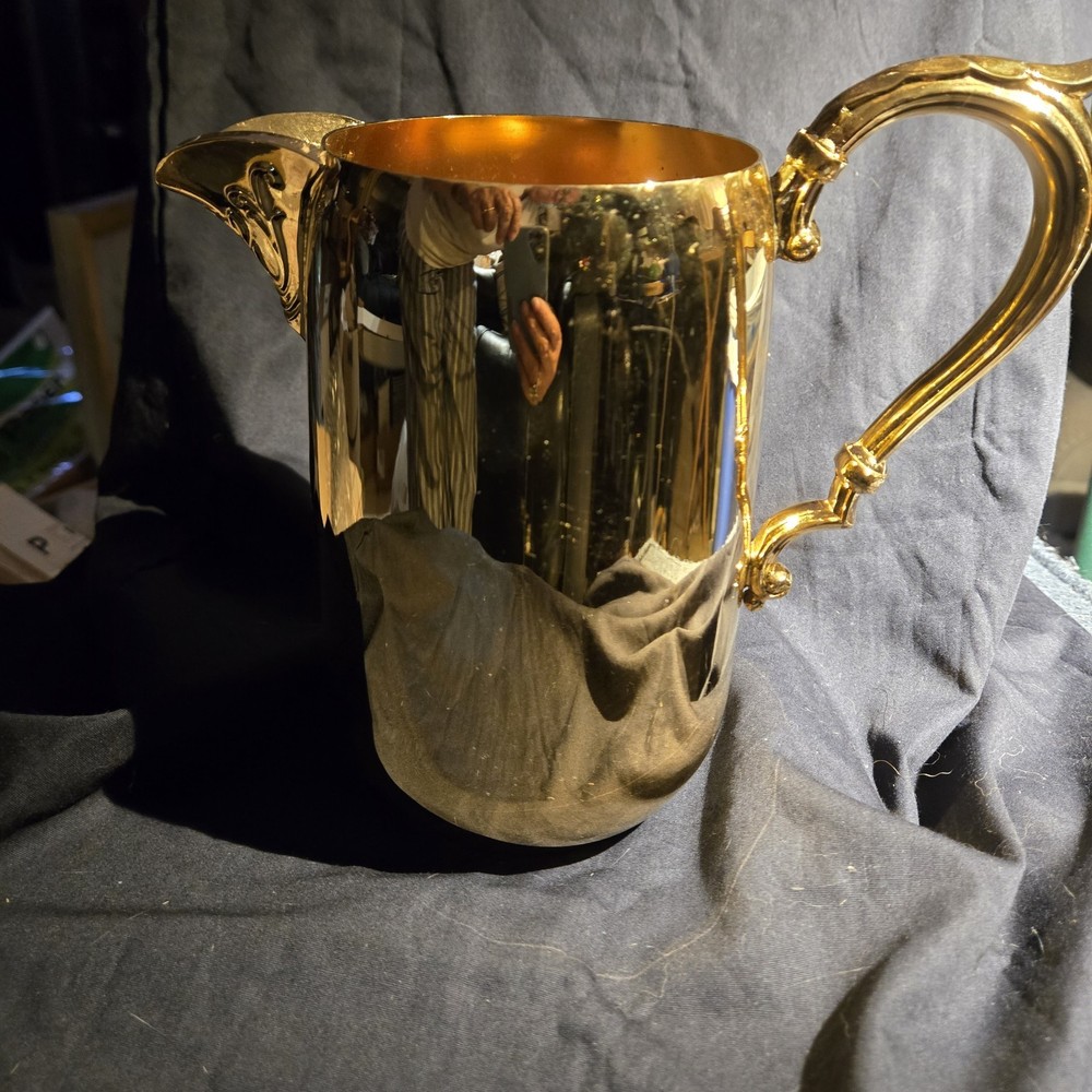 Sheridan silver-plated pitcher with ornate handle and spout