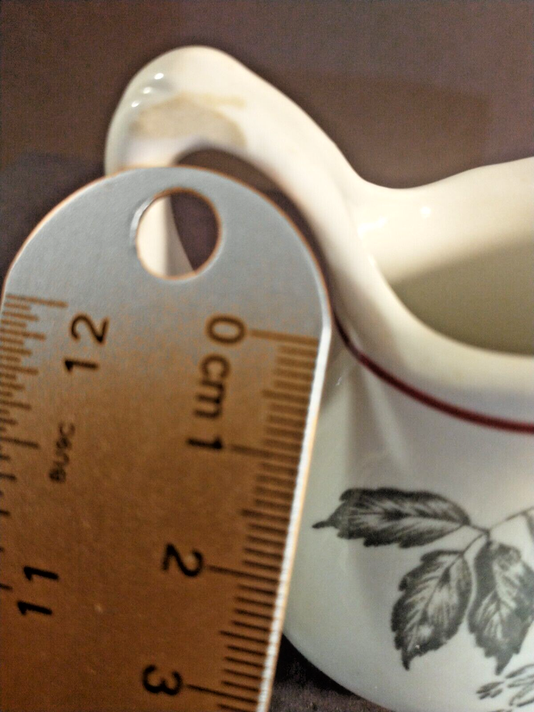 McNicol small creamer with glaze damage on handle