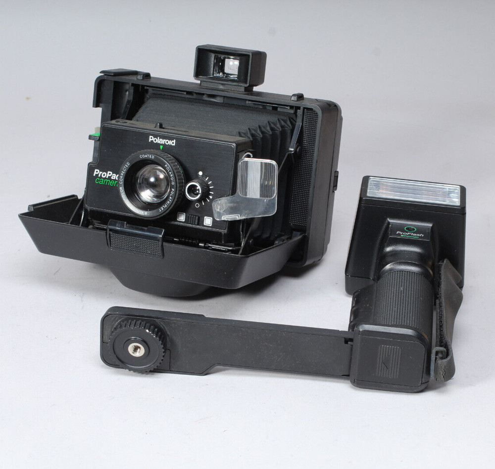 POLAROID PRO-PACK IN THE BOX W CAMERA FLASH STRAP & MANUALS FLASH BAD