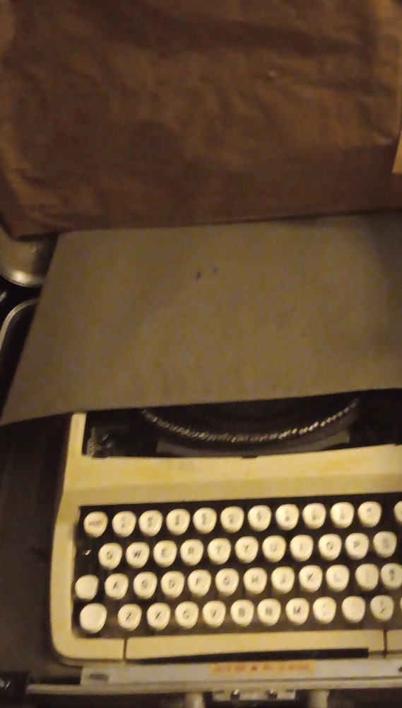 Vintage Portable Typewriter with Case and Beige Keys