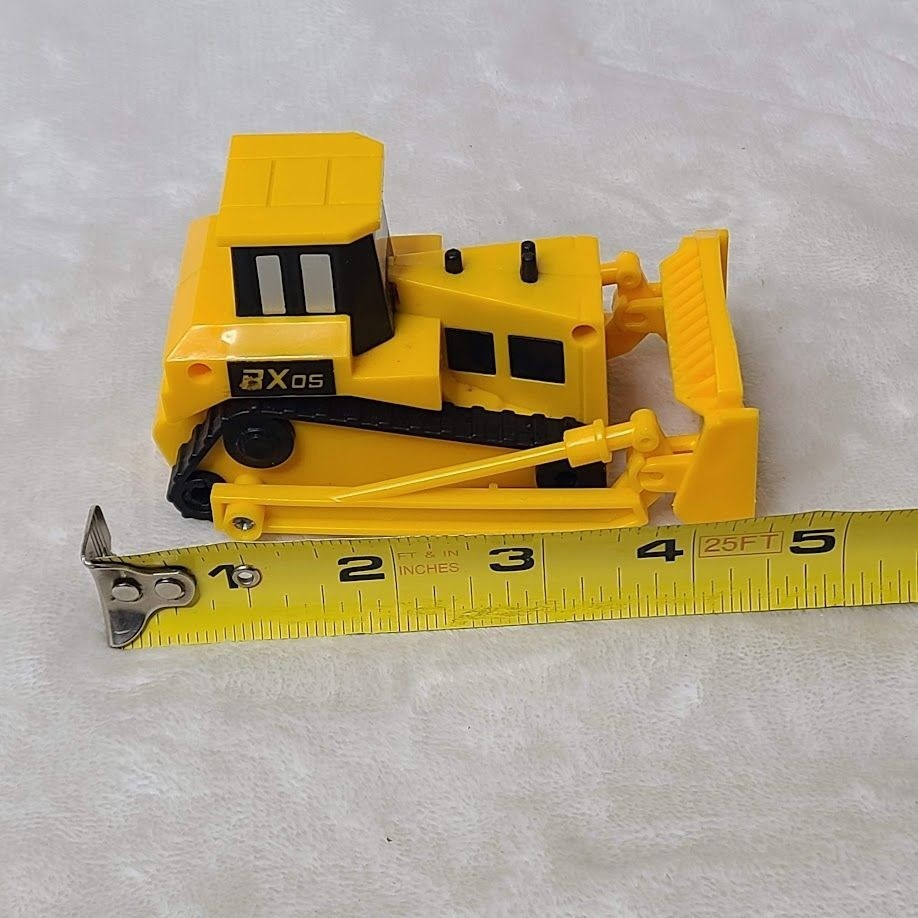 Yellow Plastic Toy Bulldozer With Movable Front Blade