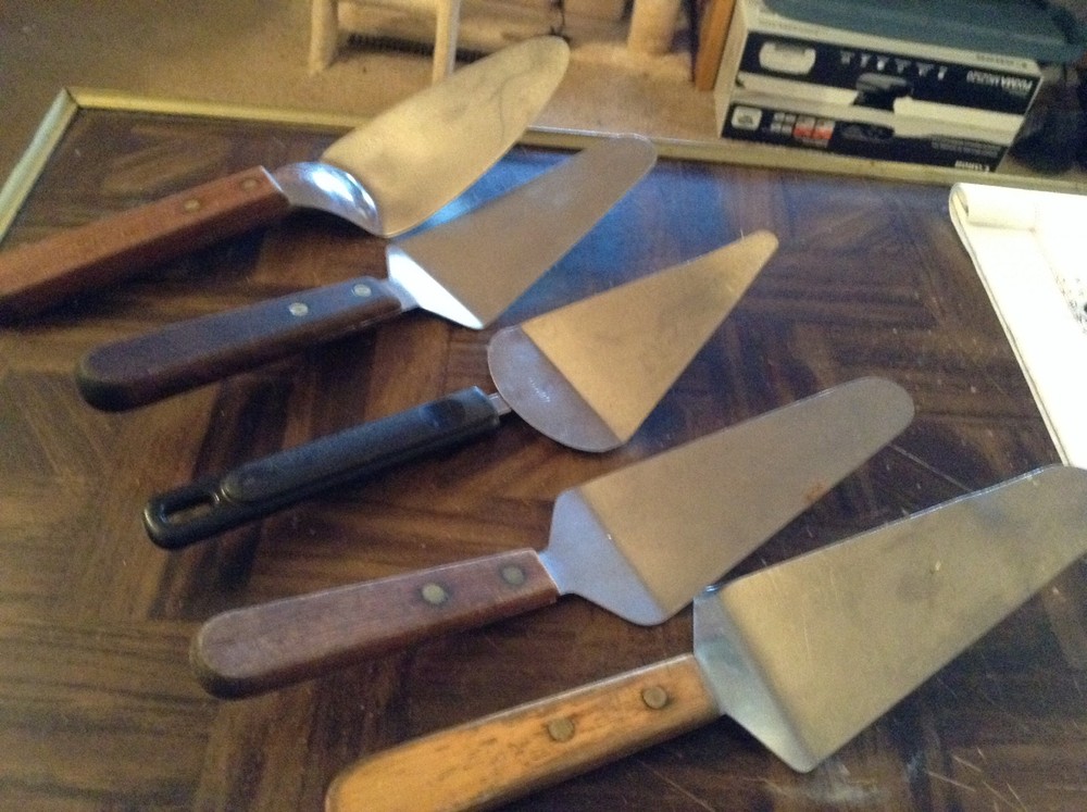 Five assorted pie servers