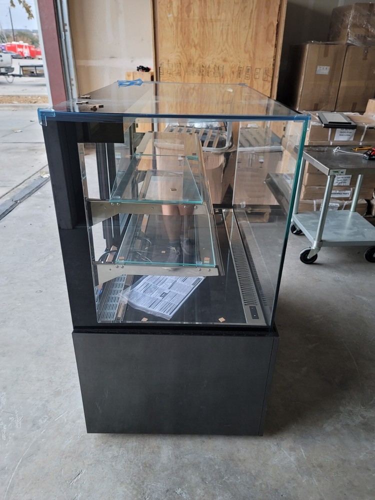 Multilevel refrigerated display case. Dessert, pastry, bakery display.