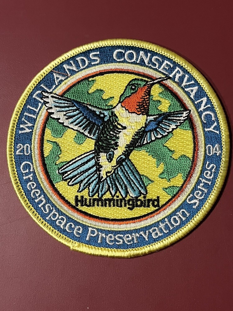 2004 WILDLANDS CONSERVANCY PATCH 4" DIAMETER "HUMMINGBIRD"