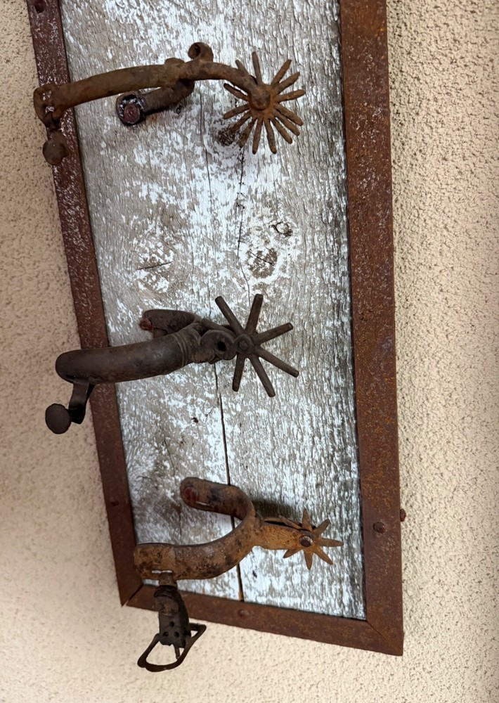 vintage western cowboy spurs display