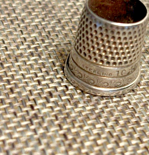 Antique silver thimble, 3/4" high, delicate scroll work and 'sterling' inscribed
