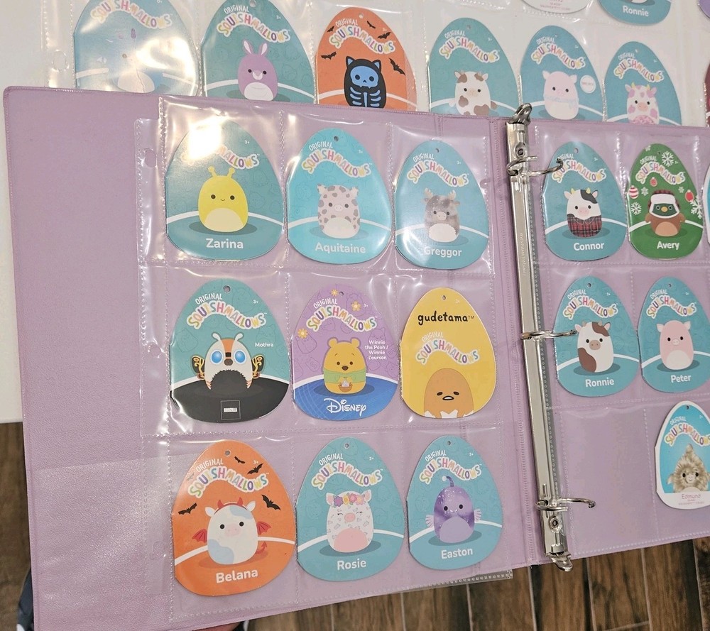 71 Squishmellow Tags In Binder. TAGS ONLY