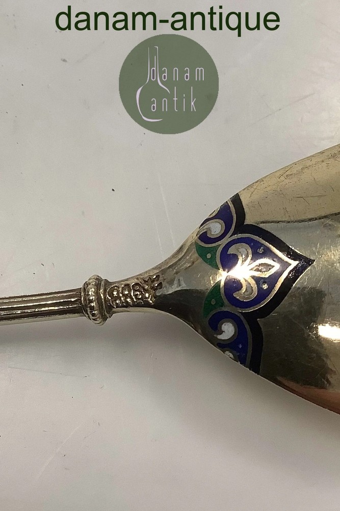 Silver spoon with enamel ornamentation and gilding