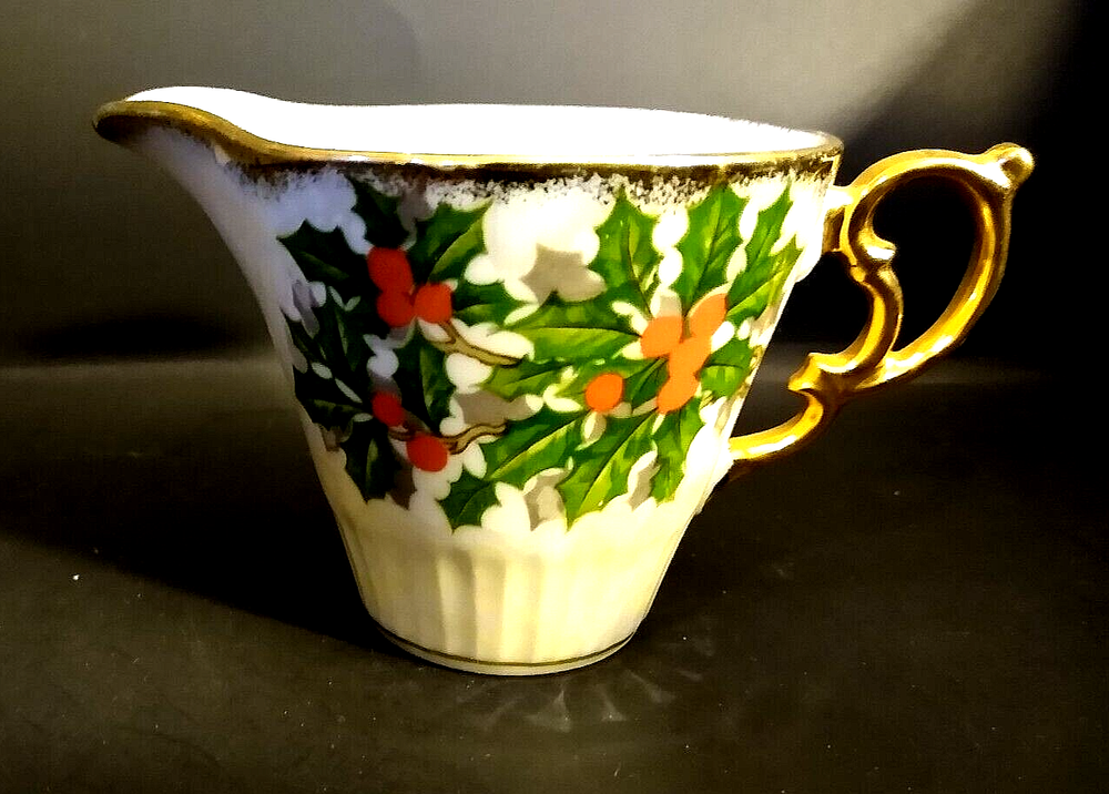 Iridescent Holly Creamer unknown maker; two small dark marks under glaze