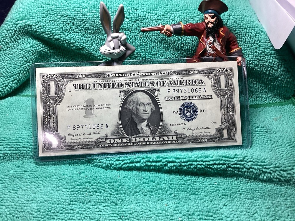 1957 A SILVER CERTIFICATE UNCIRCULATED in RIDIG HOLDER