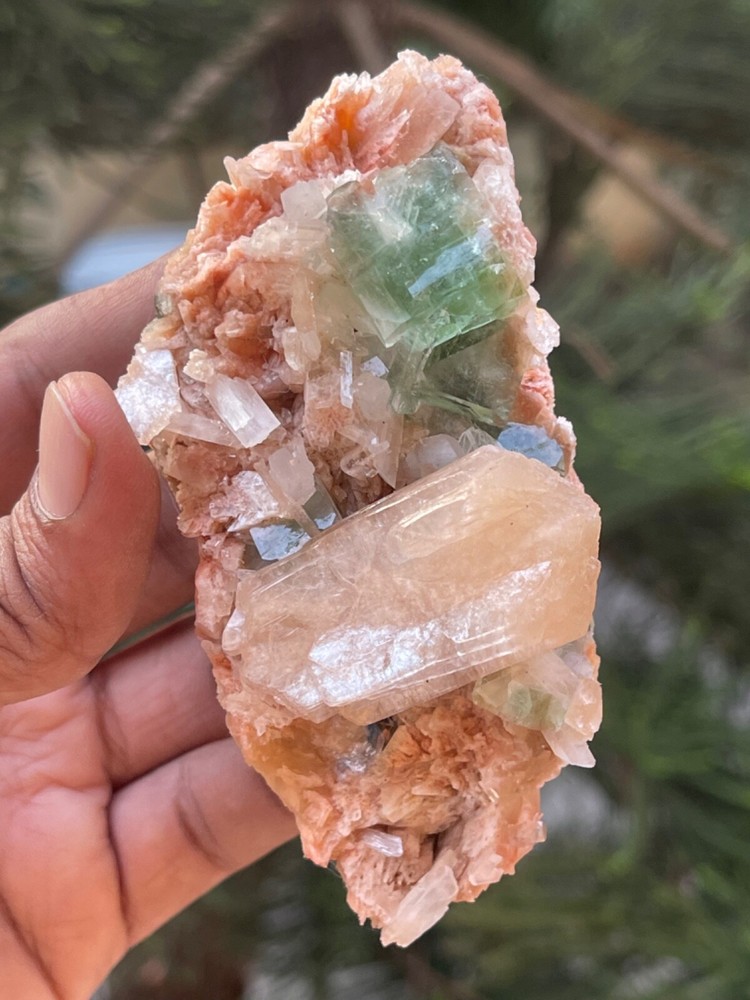 Dark green apophyllite crystals with orange stilbite