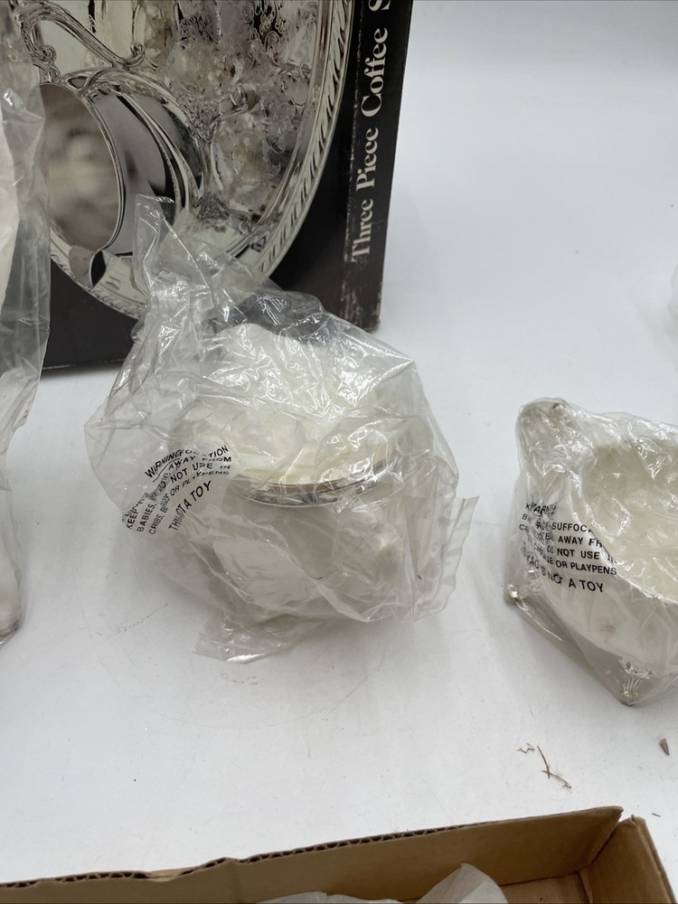 vintage "Elegance in Silver" three-piece silver-plated coffee set