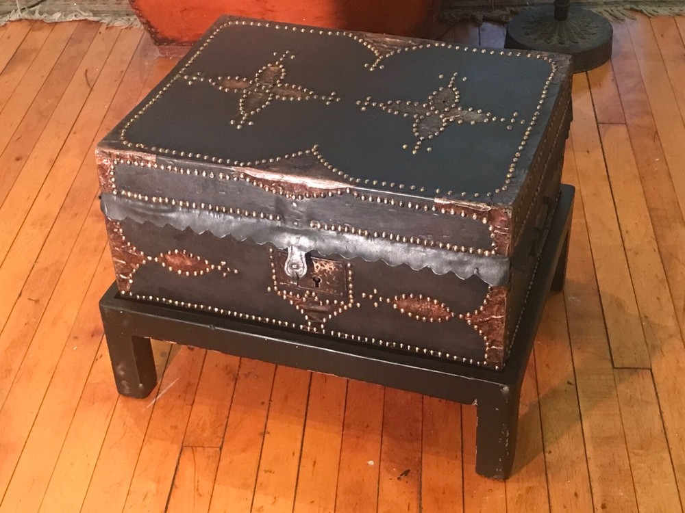 antique trunks chests on a custom stand