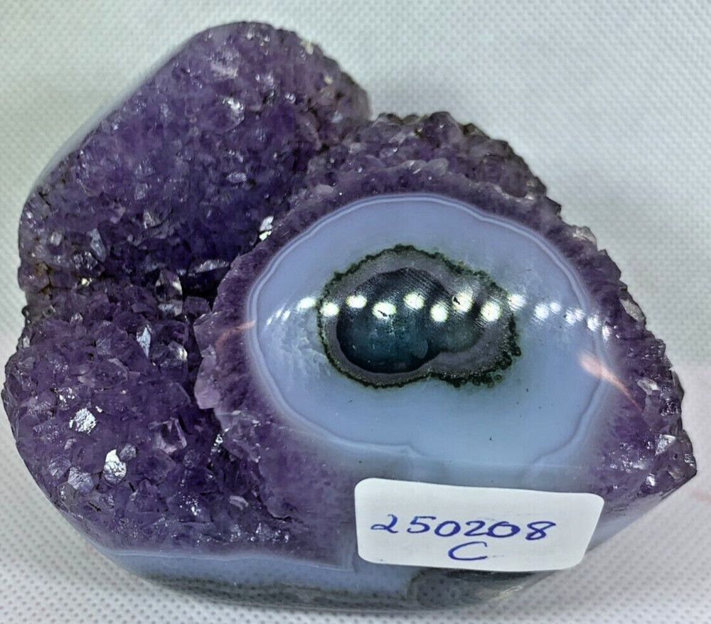 AMETHYST MOUND FACE WITH LARGE EYE AND OPEN CRYSTAL POINTS DEEP PURPLE