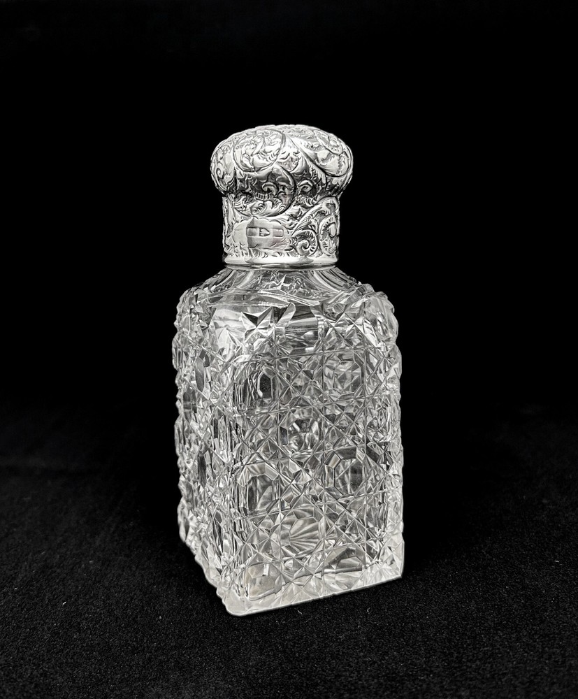Edwardian sterling silver topped perfume bottle