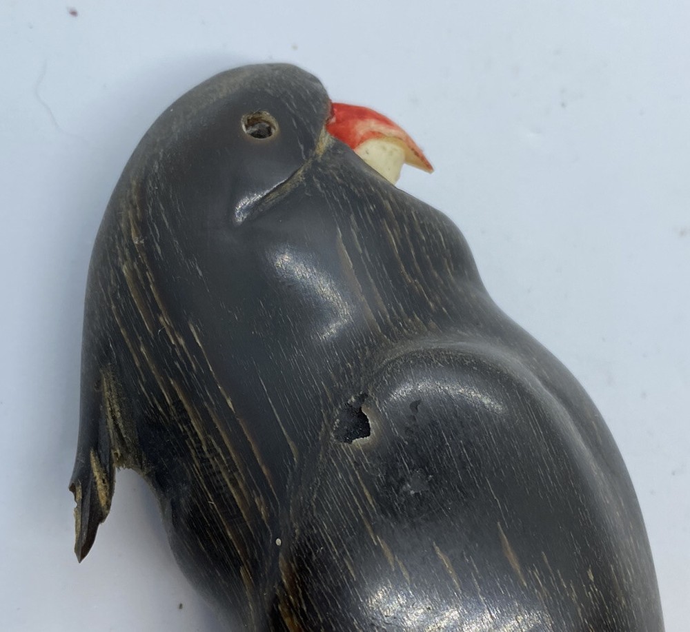 carved parrot on perch