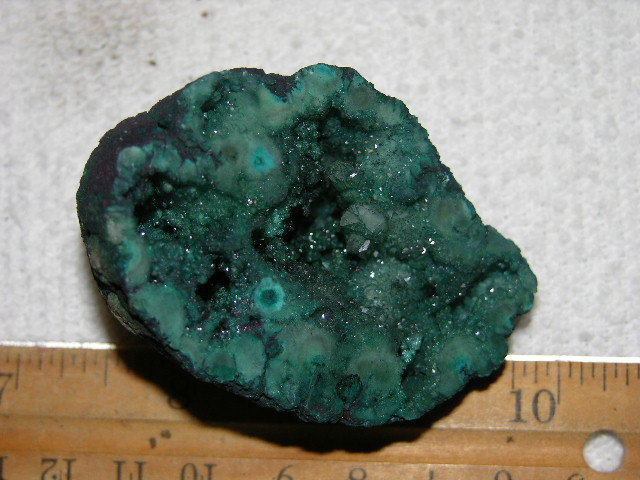 Geode cut & polished half with colored crystal center 2.5 inch E47