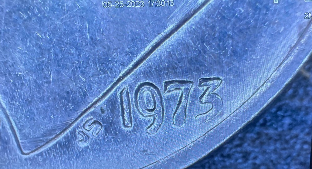 1973 no mint mark dime with DDO error