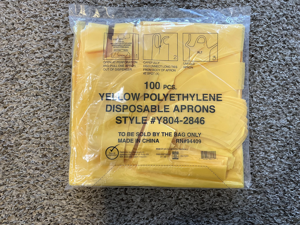 100 pcs Yellow Disposable Polyethylene Aprons – New