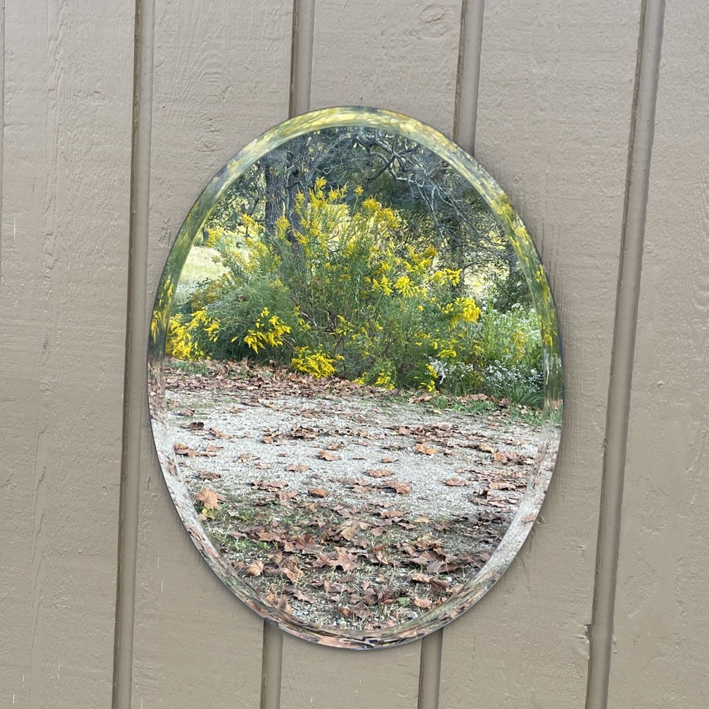 Frameless Oval Shaped Beveled Mirror 21x28”