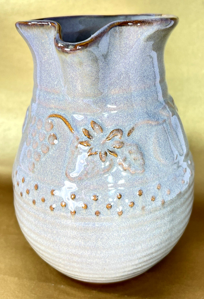 Unbranded Glazed Stoneware Pitcher embossed with fruit and glazed inside