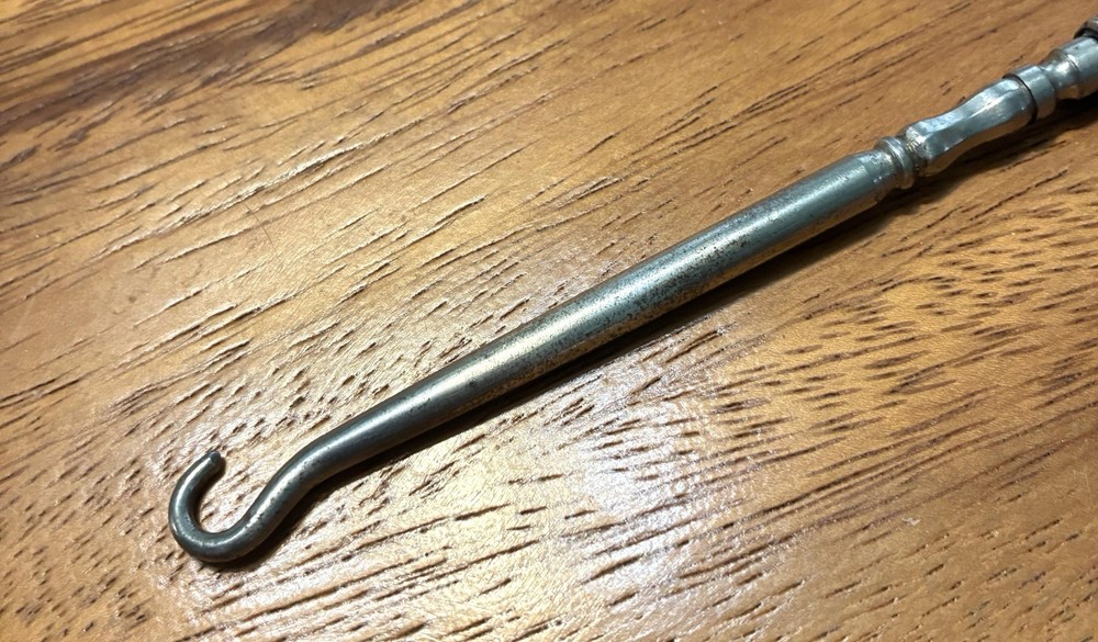 Ornate Empire Art Silver Plate Button Hook with a scrolled Victorian Handle.
