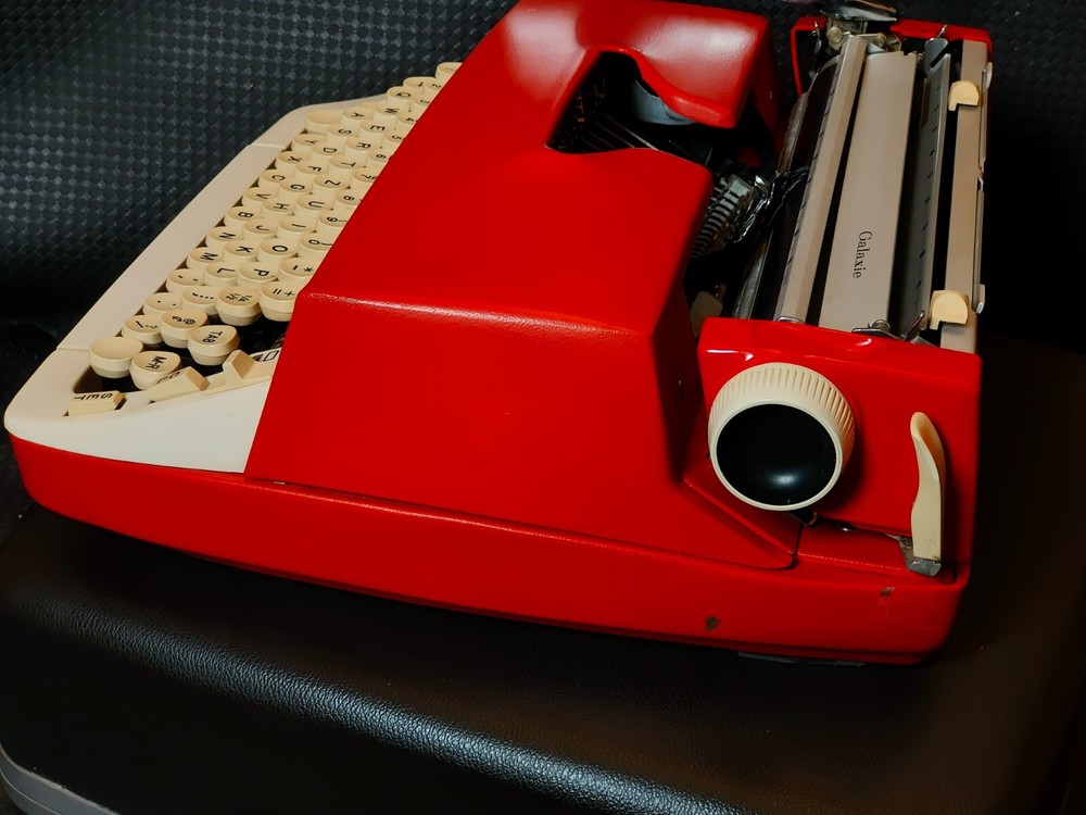 red, portable Smith Corona Galaxie typewriter with Cursive / Handwritten Script