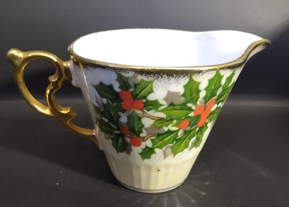 Iridescent Holly Creamer unknown maker; two small dark marks under glaze