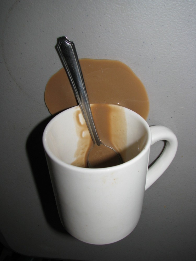 Fake Spilled Coffee Mug Display with Spoon
