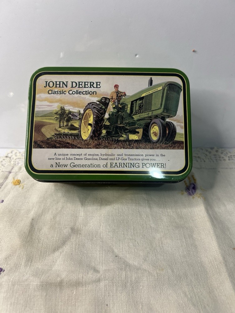 John Deere Collectible Tin And Mini Tractors