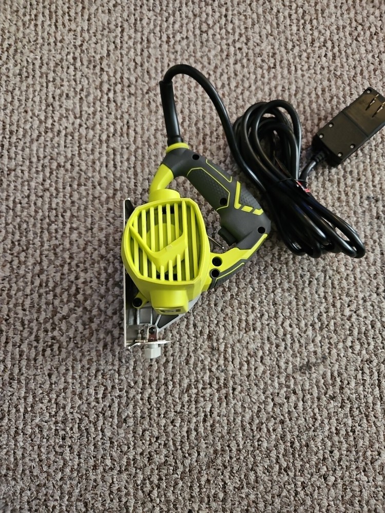 RYOBI TC401 "4" HAND HELD TILE SAW.