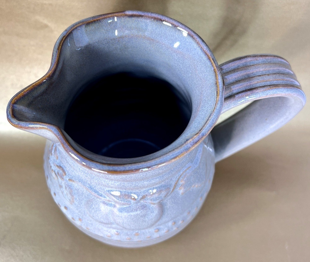 Unbranded Glazed Stoneware Pitcher embossed with fruit and glazed inside