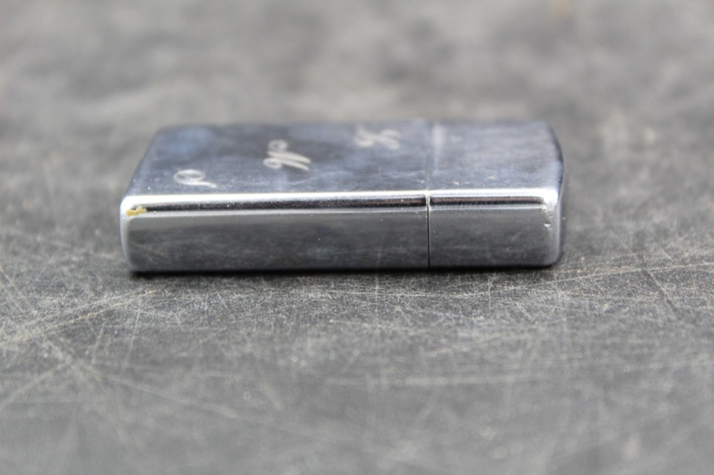Zippo Lighter 2-1/4” X 1-1/8”.