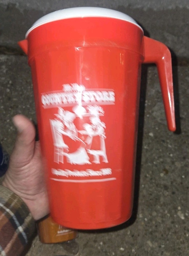 McNess Country Store. Plastic Pitcher And 4 Plastic Cups