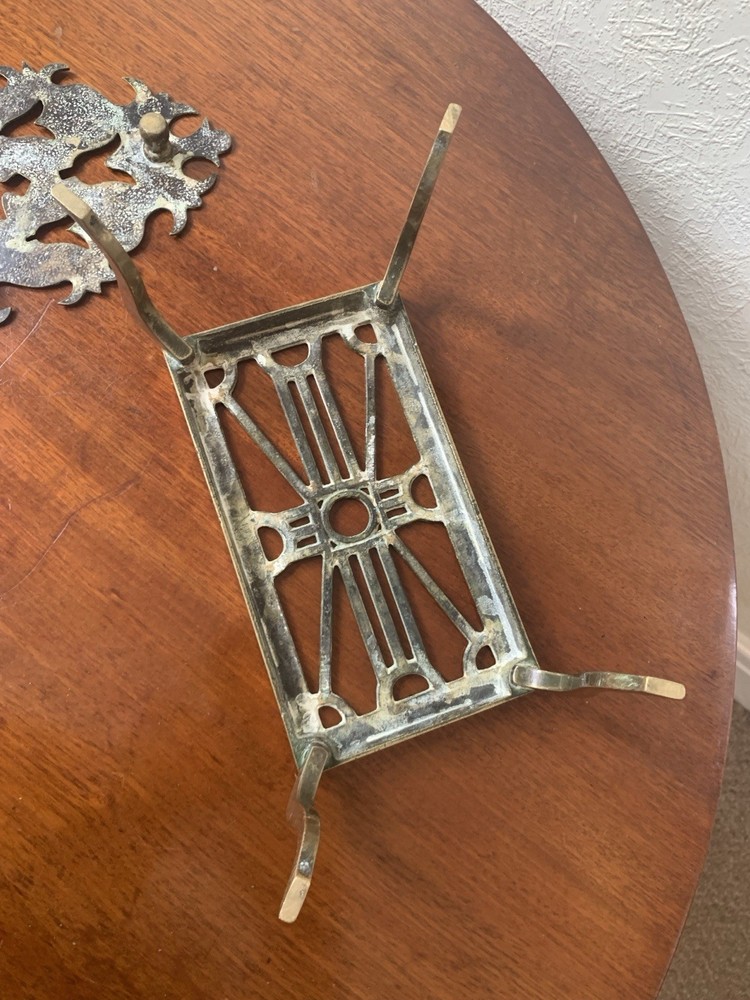 Two antique 19th century brass fireside trivets