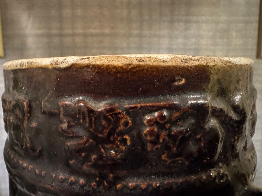 Antique Ceramic Pitcher with raised floral pattern