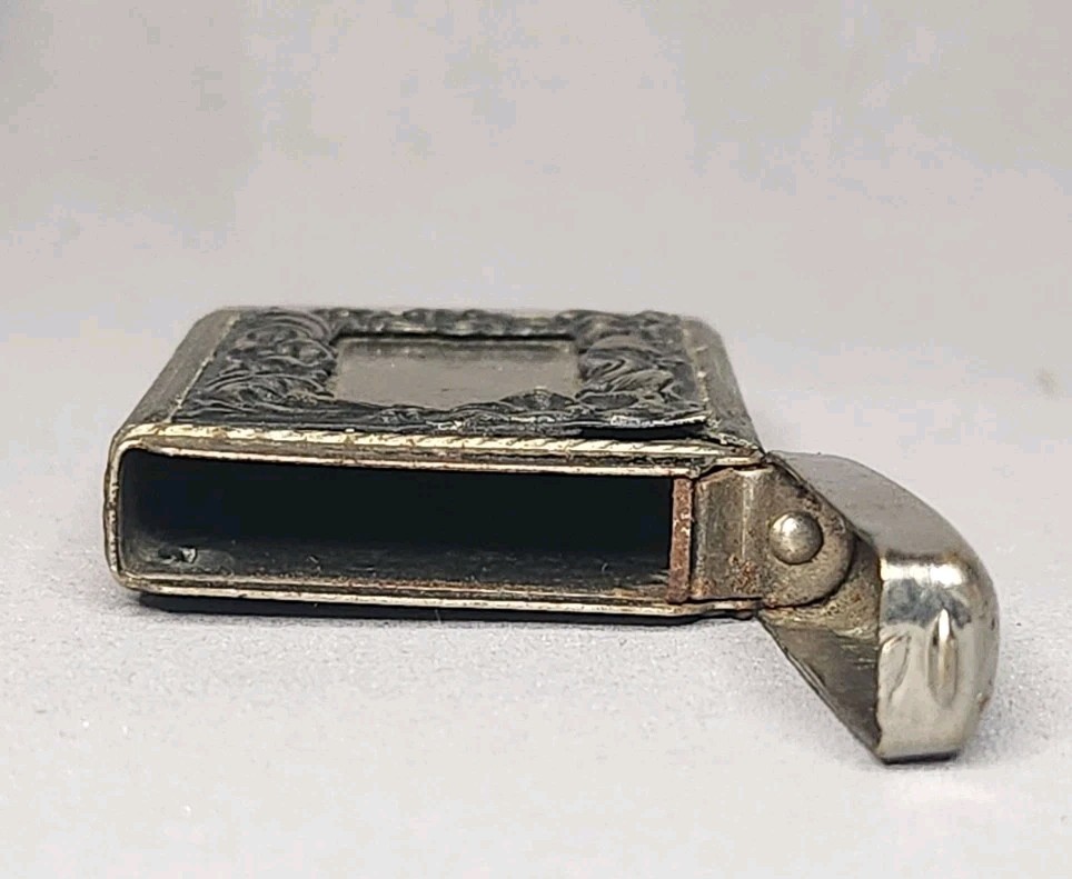 Vintage Vesta Case with Bear Pattern and Ornate Frame Design