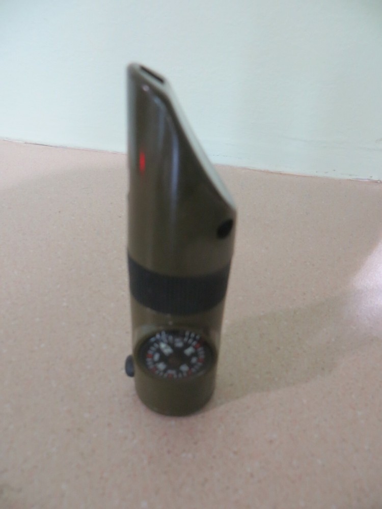 survival whistle ,light, compass thermometer ,reverse mirror inside eye checker