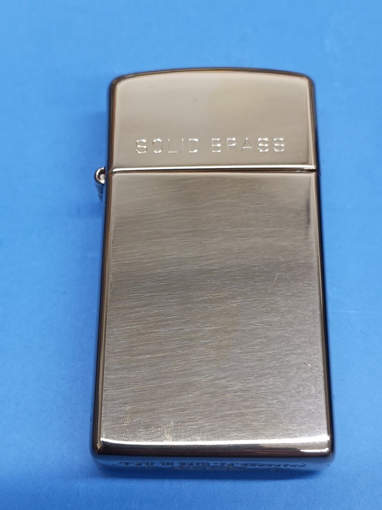 Zippo Slim High Polish Brass with Solid Brass Engraved 1654