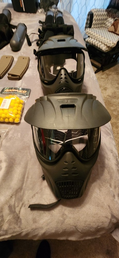 2 paintball guns with accessories