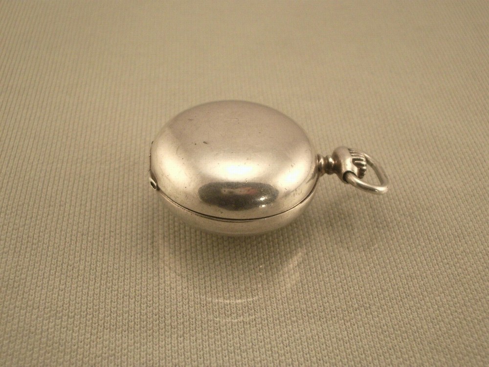 ANTIQUE SILVER COIN HOLDER